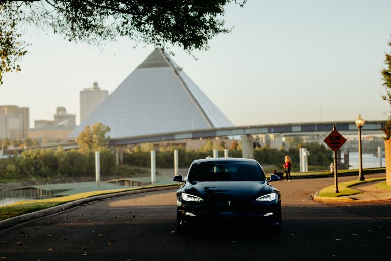 Electric vehicle driving away from Memphis Bass Pro Shops pyramid