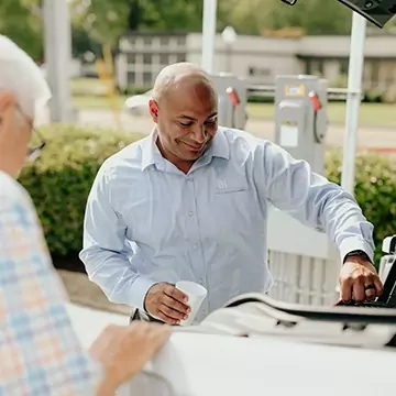 Man getting into car