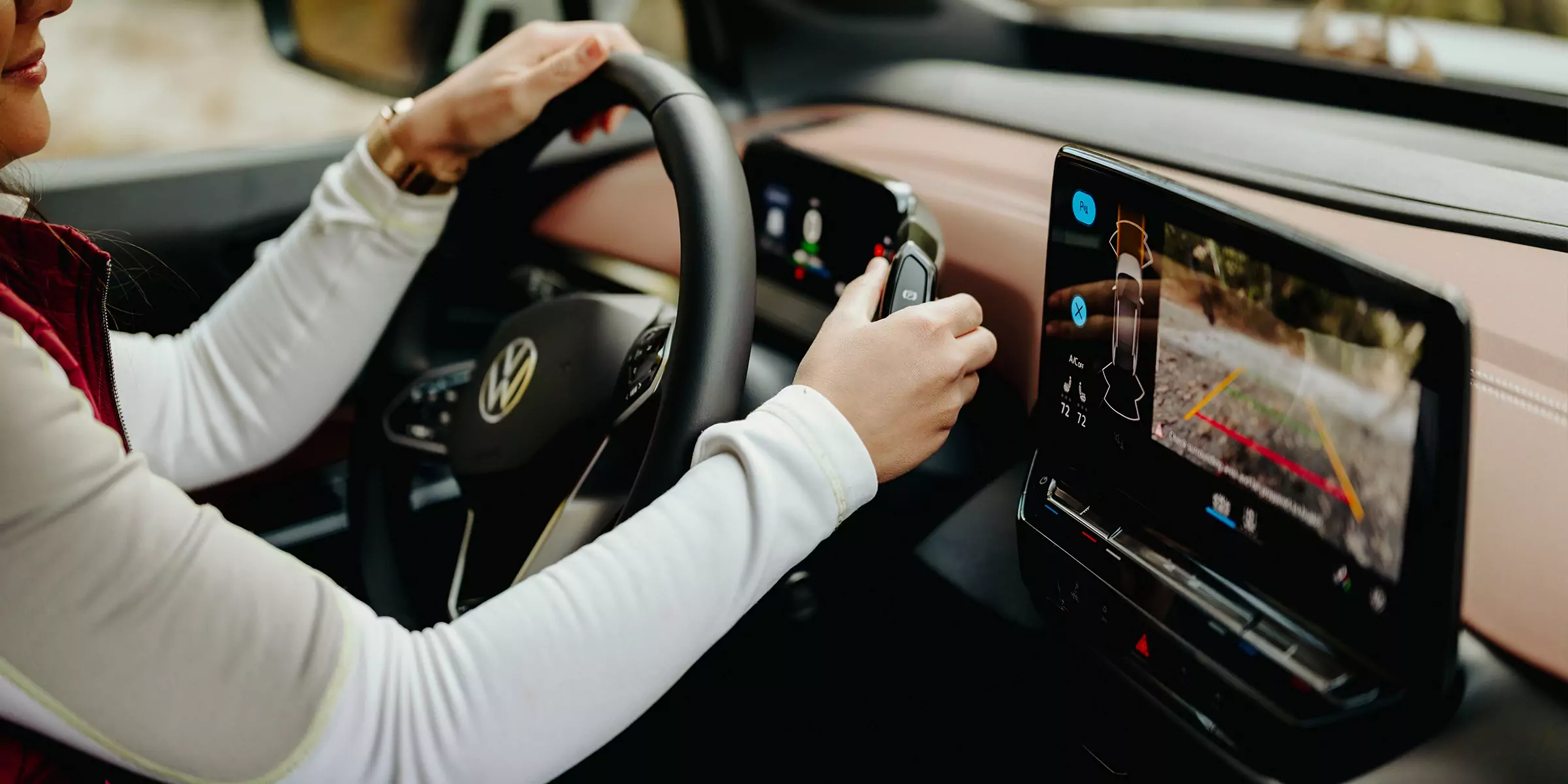 Close up of hands on steering wheel in electric vehicle
