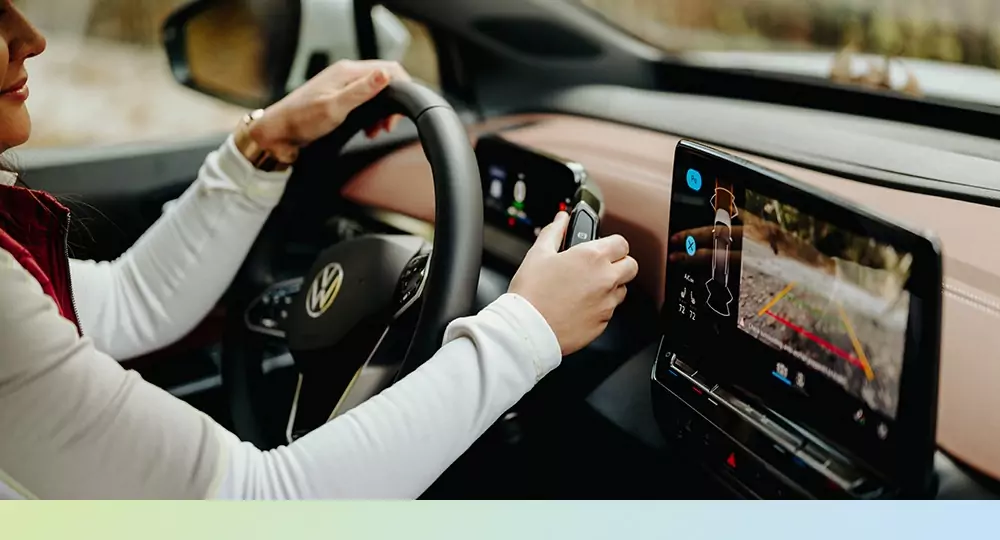 Woman driving an electric vehicle.