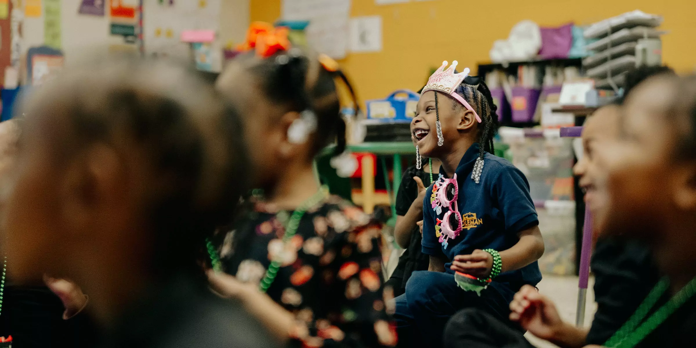 Elementary school student laughing.