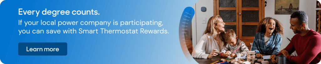 Image of a happy family, playing games. When you click on the image, it will take you to a page to learn more about the Smart Thermostat Rewards program.