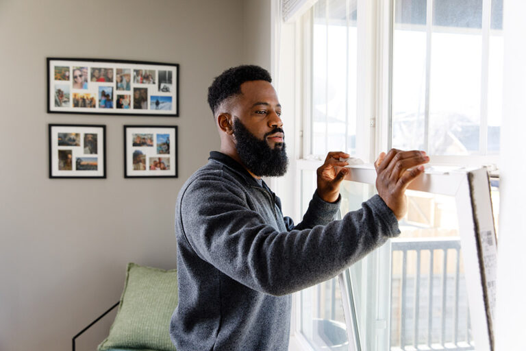 man inspecting windows.