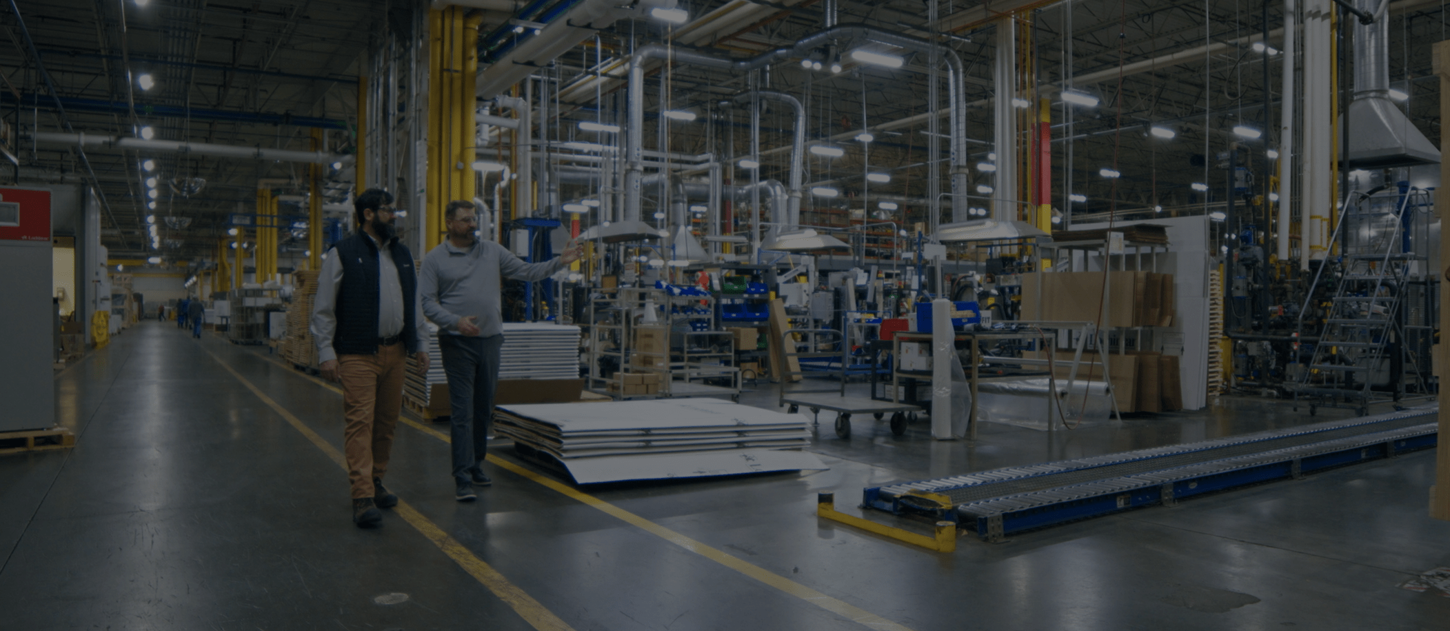 Energy advisor talking to plant operations manager