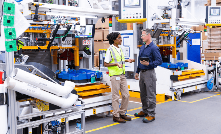 Energy advisor talking to a facilities manger about dispersed power production.