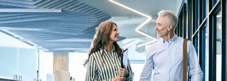 Office workers in a modern office with LED lighting