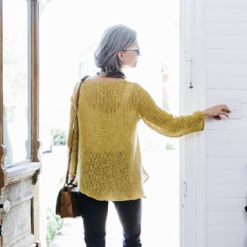 Homeowner opening the front door to enter a home