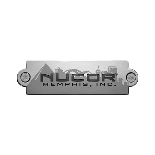 NUCOR MEMPHIS, INC. corporate logo, featuring the name on a metallic plate with a city skyline.