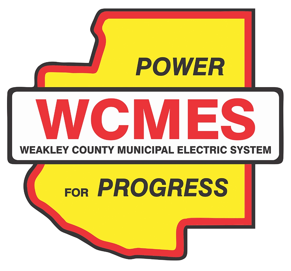 Weakley County Municipal Electric System corporate logo with text: POWER WCMES WEAKLEY COUNTY MUNICIPAL ELECTRIC SYSTEM FOR PROGRESS.
